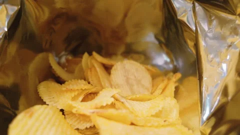 Close up potato chip inside foil bag Stock Footage 261844460