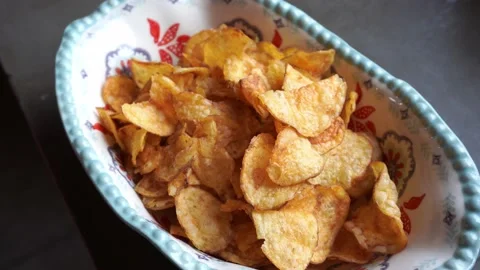Close-up of potato chips in a bowl Stock Footage 199581559