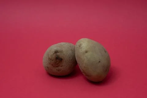 Close-up of Potato on red backgraound Stock Photos