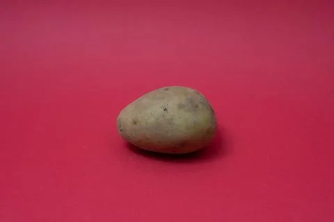 Close-up of Potato on red backgraound Stock Photos