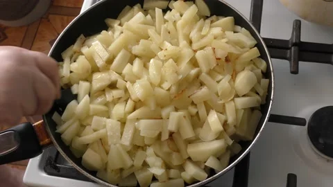 Close-up - potatoes are fried in a pan Stock Footage 160947857