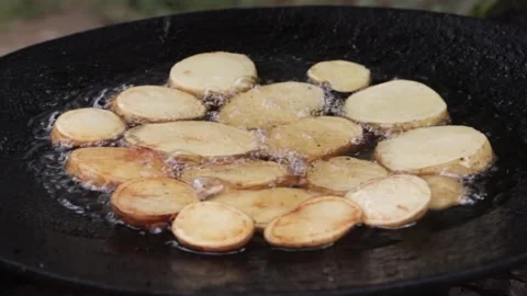 Close-up of potatoes being prepared. Crispy potatoes are fried in hot boiling 스톡 동영상 201131081