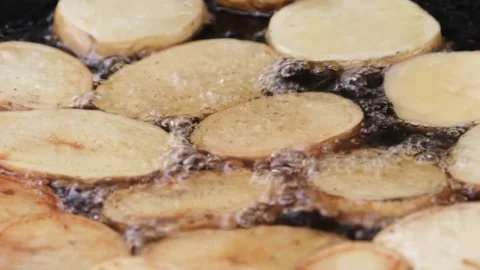 Close-up of potatoes being prepared. Crispy potatoes are fried in hot boiling 스톡 동영상 201131084