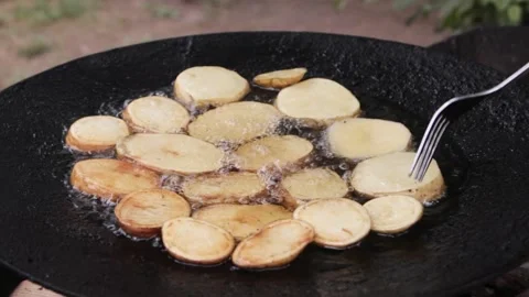 Close-up of potatoes being prepared. Crispy potatoes are fried in hot boiling 스톡 동영상 201131088