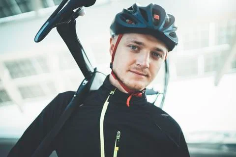 Close-up potrait of young smiling man cyclist outside Free Stock Photos