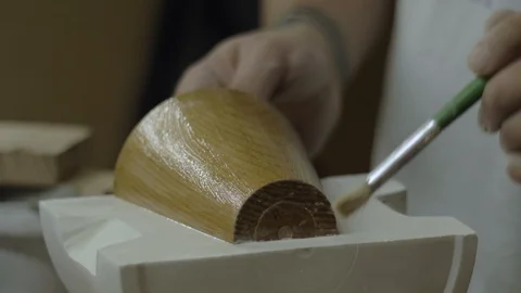A close-up of a potter applying vasilin with a brush on a gypsum. 4k video Stock Footage 118087914