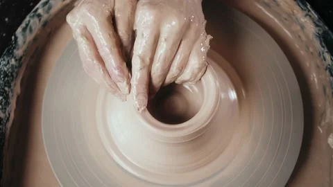 Close up of potter clay wheel, pottery workshop, woman making diy pot to sale in Stock Footage 147617093