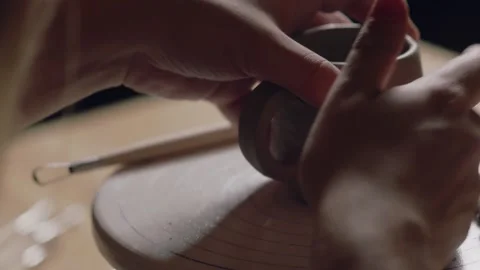 Close up of potter finishing to making ceramic clay cup in potter studio Stock Footage 143617390