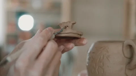 Close-up of Potter hands makes tableware made of handmade ceramics. Craft Stock Footage 152335571