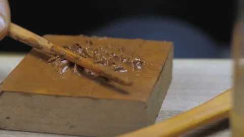 Close-up potter interferes with Yixing clay with a wooden stick. . 4k video Stock Footage 120586563