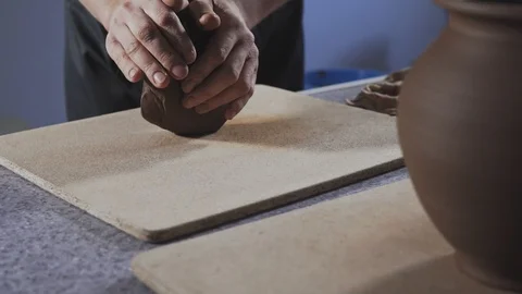 Close up of Potter kneads the clay on table Stock Footage 111754861