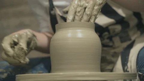 Close-up of potter makes a earthen clay jag Stock Footage 105128628