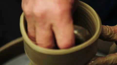 Close up of a potter making a clay pot at a wheel Stock Footage 130386007