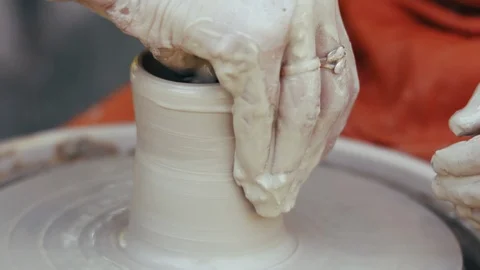 Close-up, Potter Teaches His Apprentice Pottery on the Pottery Circle Stock Footage 122111038