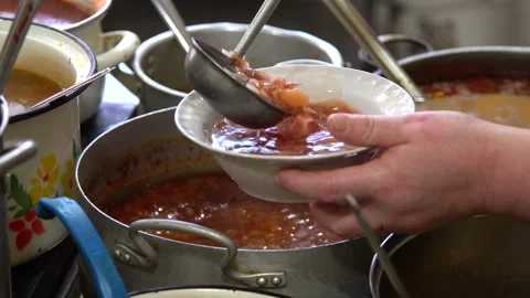 Close-up. pour borscht from the pan into a plate. soup, portion Stock Footage 131760253