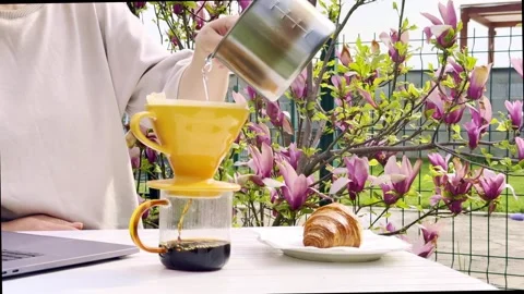 Close Up of Pour Over Coffee Brewing Outdoors on Sunny Spring Morning Stock Footage 334571945