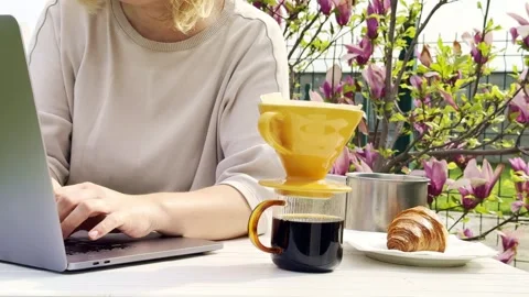 Close Up of Pour Over Coffee Brewing Outdoors on Sunny Spring Morning Stock Footage 334571978
