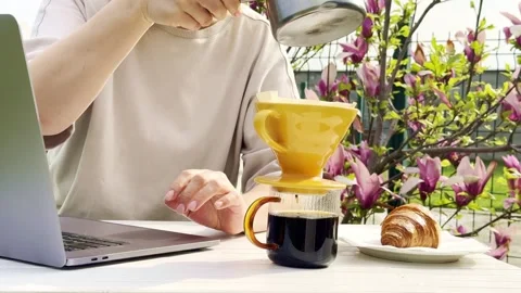 Close Up of Pour Over Coffee Brewing Outdoors on Sunny Spring Morning Stock Footage 334572052