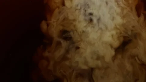 Close-up pouring and mixing white cream milk into hot black coffee, slow motion Stockbeeldmateriaal 142187798