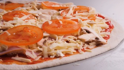 Close-up pouring cheese on pizza slow motion Stock Footage 125981876