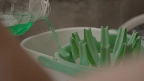 Close Up of Pouring Cleaning Liquid Into Mop Bucket for Household Floor Washing Stock Footage 337546531