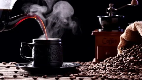Close-up pouring coffee into black mug with beautiful natural steaming smoke Stock Footage 218258013