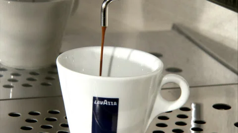 Close up of Pouring Coffee Into Cup Stock Footage 130283597