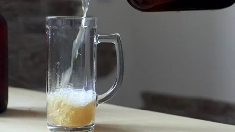 Close-up of pouring cold beer into a glass. Stock Footage 194249306