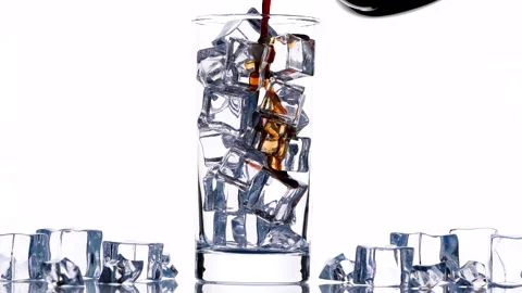 Close up pouring iced black coffee into drinking tall glass with iced 動画素材 203907211