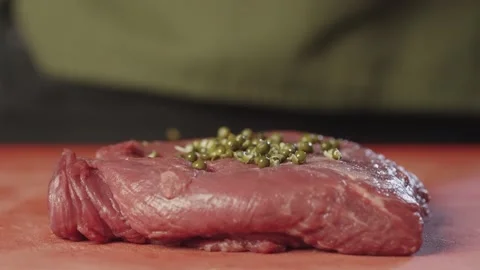 Close-up of pouring ingredients for marinating steak. Video stock 233814424