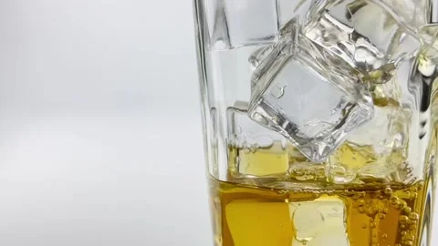Close up pouring lemon tea with ice, soft drinks isolated white grey background Stock Footage 204113444