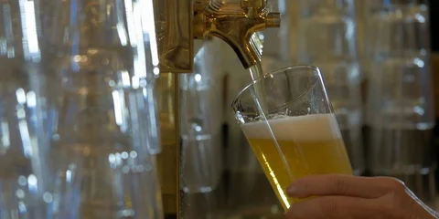 Close-up of pouring a light beer from a tap at a bar. Stock Footage 114193196