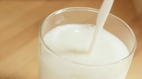 Close up pouring milk Stock Footage 12608794