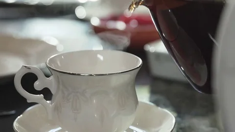 Close up of Pouring Tea into a Ceramic Cup Stock Footage 70225462