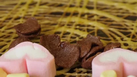 Close-Up of Pouring Toppings and Marshmallows onto a Sweet Crepe Video stock 345692492