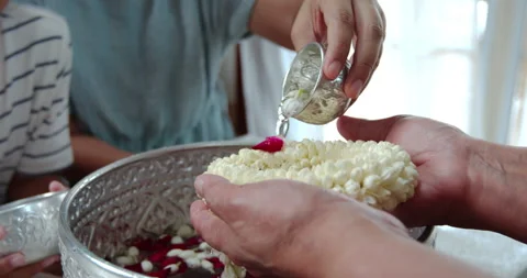 Close up, pouring water on hands of elder senior in Songkran festival Stock Footage 287564320