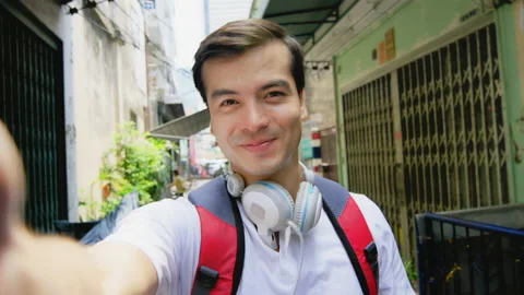 Close up pov of Asian man's face, using smart phone, recording selfie, wile talk 스톡 동영상 201095988