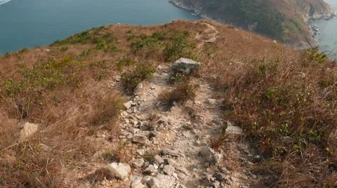 Close POV rocky path in motion, walk downhill along deserted trail Video stock 57321913