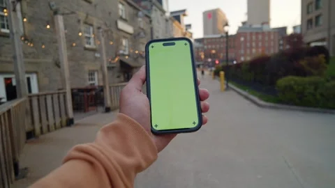 Close-Up POV Of Vertical Green Screen Phone - City Sunset Aesthetic Stock Footage 309475161