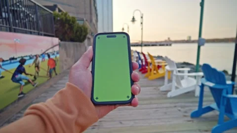 Close-Up POV Vertical Green Screen Phone At Sunset - Cityscape View Stock Footage 309475672