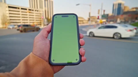 Close-Up POV Vertical Green Screen Phone In Hands - Sunset City Skyline Stock Footage 309475811