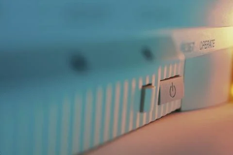 Close-up of a power button on a computer device Stock Photos