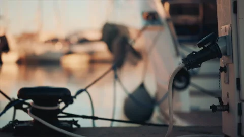 Close up of a power cable plugged into a yacht at sunset Stock Footage 320628589