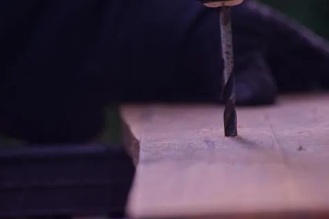 Close Up of Power Drill Boring Hole Into Wooden Board Stock Photos
