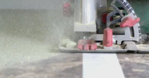 Close up of power saw cutting through wooden surface Stock Footage 302342439
