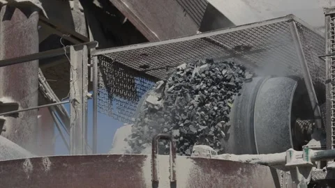Close-up of a powerful rock crusher producing crushed stone. Video stock 278015624