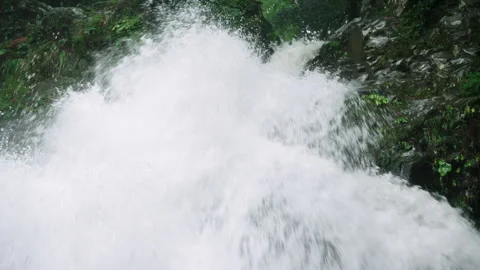 Close up of powerful waterfall, the water is gushing very quickly down a granite Video stock 130369466