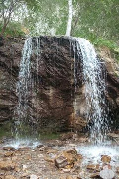 Close-up of a powerful waterfall in the wild in high quality. Stock Photos