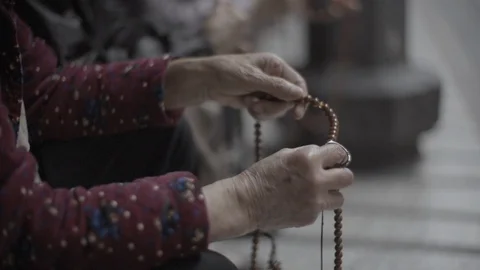 Close up of prayer beads being used Stock Footage 85813670