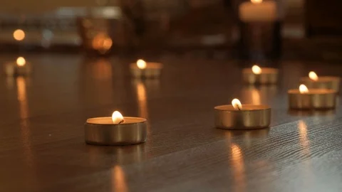 Close up Prayer Tea Candles on the floor Stock Footage